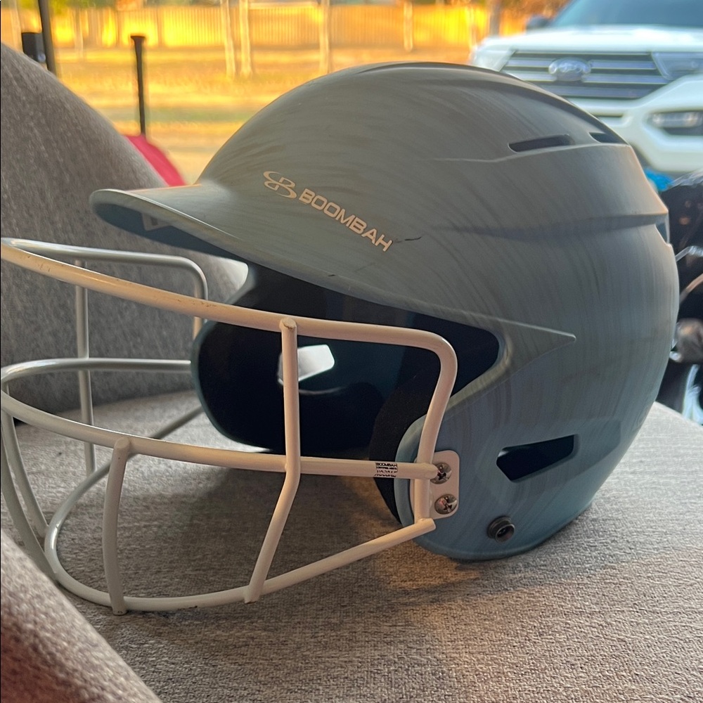 Boombah helmet jr 6-1/4:7. Never used. Light blue, grey brush strokes.